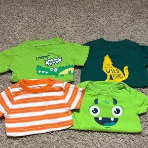 Set of Four onesies with Fun Prints- size 6-9 months